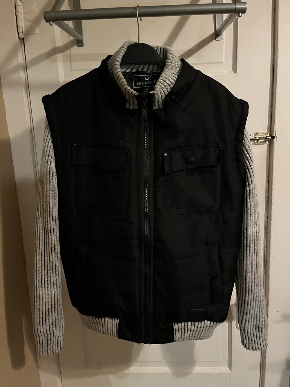 Nick Danger Black Puffer Vest with Gray Knit Sleeves
